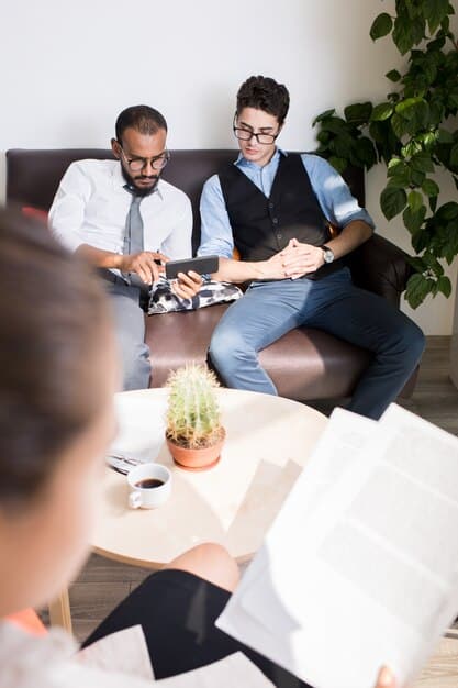 A group of employees in Spain discussing work-life balance initiatives and flexible working arrangements.